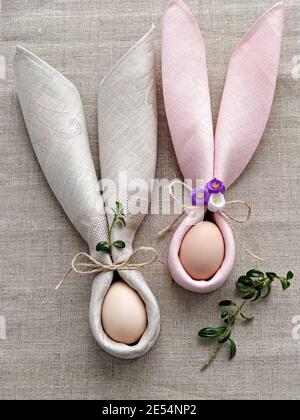 Two Bunny Ears with eggs for table decoration to Celebrate Easter, flat lay Stock Photo