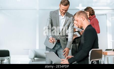 two business people using a laptop are preparing for the next meeting Stock Photo