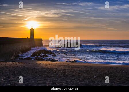 Felgueiras Lighthouse during sunset over Atlantic Ocean in Foz do Douro district of Porto city, second largest city in Portugal Stock Photo