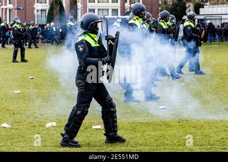 AMSTERDAM, NETHERLANDS, JANUARY 24: Riot police are seen clashing with protesters near the Museumplein on January 24, 2021 in Amsterdam, Netherlands. Stock Photo