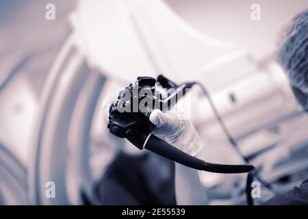 Endoscopy probe in the doctor's hand during procedure. Stock Photo