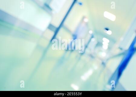 Blurred person in hospital hallway, unfocused background. Stock Photo