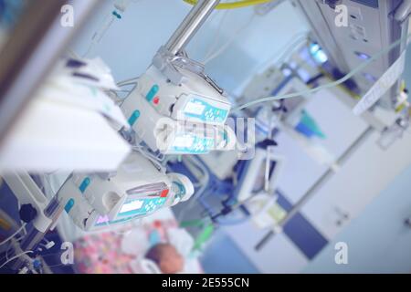 Complex of tangled tubes and technology wires in the modern ICU chamber. Stock Photo
