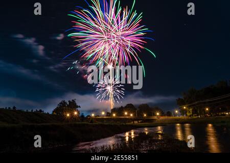 Prattville, Alabama, USA - July 4, 2017: Fireworks display for Independence Day with resident lined up along the creek to view in Prattville, a small Stock Photo