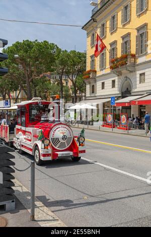 Lugano, Switzerland - June 14, 2019: Tourist Train Transport at Street in Lugano, Switzerland. Stock Photo