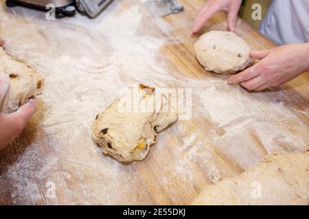 Bread baking process. Women make pies from dough Stock Photo