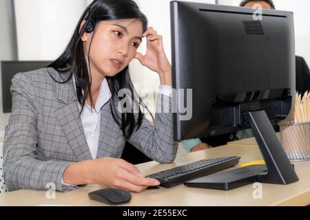 Business people wearing headset feel unhappy working in office . Failure negative sadness emotion concept of call center, telemarketing and customer Stock Photo