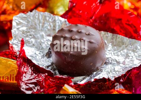 Quality Street strawberry cream chocolate sweet unwrapped closeup Stock Photo