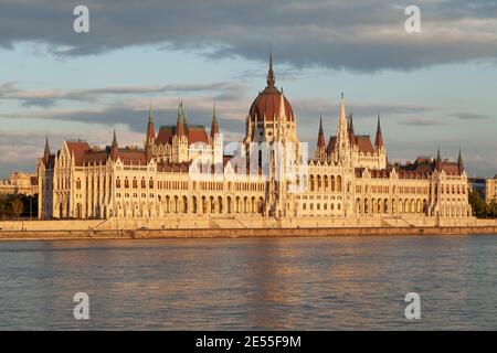 Budapest, Hungary - July 17, 2012: The Hungarian Parliament seen from across the Danube River, on the Buda side, is reflected in the river's waters as Stock Photo