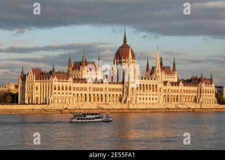 Budapest, Hungary - July 17, 2012: The Hungarian Parliament seen from across the Danube River, on the Buda side, is reflected in the river's waters as Stock Photo