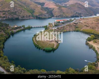 Douro wine valley region, Portugal. Vineyards landscape with beautiful farm. Tourist attraction and travel destination. Drone aerial top view. Bend sh Stock Photo