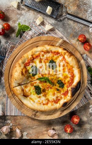 Italian pizza margarita with pesto sauce. Stock Photo