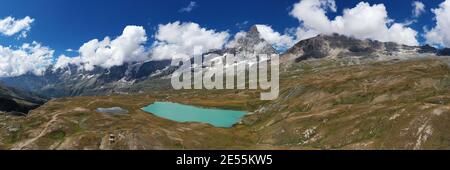 Aerial view of mount Cervino (Matterhorn) and Tramail de Vieille lake from the fields of Plan Maison, Aosta Valley, northern Italy. Stock Photo