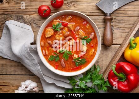 Spicy red kidney bean stew with pork, tomato and bell peppers Stock Photo