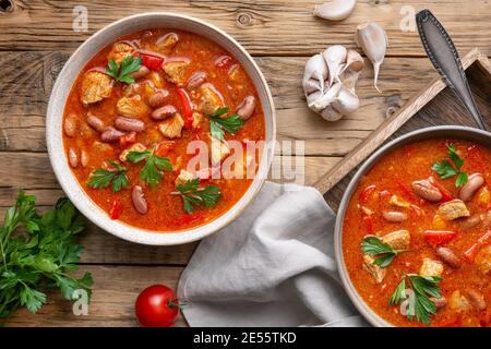 Spicy red kidney bean stew with pork, tomato and bell peppers Stock Photo