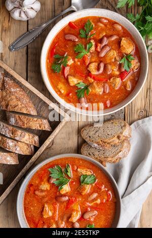 Spicy red kidney bean stew with pork, tomato and bell peppers Stock Photo