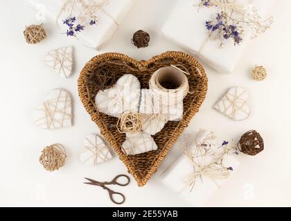 Gift box wrapped in craft paper with dried flowers Stock Photo - Alamy