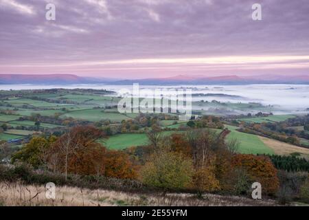 A view over St Catwg's church in Cwmcarvan towards the Black Mountains. Stock Photo