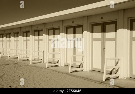 white beach hut doors sunshade wooden holiday Stock Photo - Alamy