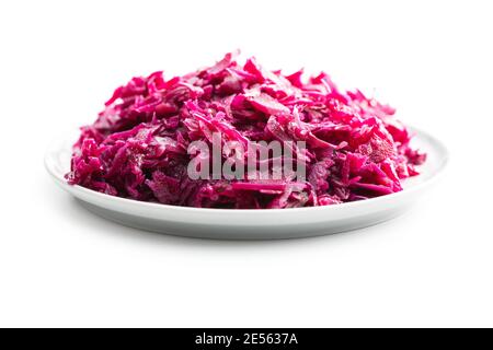 Red sauerkraut. Sour pickled cabbage on plate isolated on white background. Stock Photo