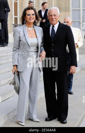 Actress Claudia Cardinale and Italian designer Giorgio Armani pose in the courtyard of the Elysee Palace in Paris, France on July 3, 2008, prior to be awarded with France's most prestigious Legion d'Honneur medal by French President Nicolas Sarkozy. Photo by Orban-Taamallah/ABACAPRESS.COM Stock Photo