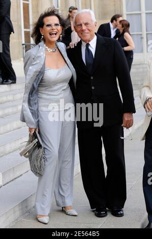 Actress Claudia Cardinale and Italian designer Giorgio Armani pose in the courtyard of the Elysee Palace in Paris, France on July 3, 2008, prior to be awarded with France's most prestigious Legion d'Honneur medal by French President Nicolas Sarkozy. Photo by Orban-Taamallah/ABACAPRESS.COM Stock Photo