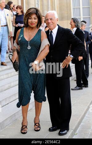 US singer Tina Turner poses with Italian designer Giorgio Armani