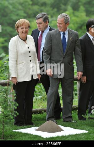 Heads of states (L-R) German Chancellor Angela Merkel, Britain's PM Gordon Brown and US President George W. Bush plant the memorial tree after a working session on the second day of the G8 Hokkaido Toyako Summit at the Windsor Hotel Toya in Toyako Japan, on July 8, 2008. Photo by Thierry Orban/ABACAPRESS.COM Stock Photo