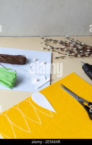 How to make an Easter garland of rabbits and carrots with your own hands from felt. Step by step instruction. Step 4. Mark on the felt. Stock Photo