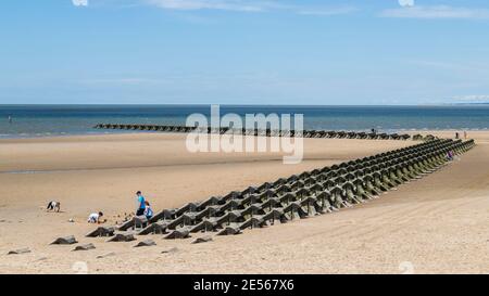 Modern sea defences on Wallasey beach. Stock Photo