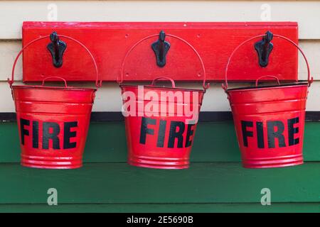 Close up of red fire buckets hanging on the platform.