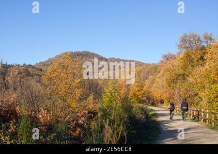 Bikers enjoy Green-Way Itinerary by Banos de Montemayor on Magic Autumn season, Extremadura, Spain Stock Photo