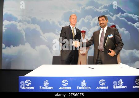 Emirates Chairman and CEO Sheikh Ahmed Bin Saeed Al Maktoum (R) shakes hands with Airbus President and CEO Tom Enders after signing an order for 60 more planes (30 A350 and 30 A330), during the handing over ceremony of the first Airbus A380 to Arabian airline 'Emirates' at the Airbus plant in Hamburg, Germany on July 28, 2008. The first scheduled flight will take place on 01 August, flying from Dubai to New York. Emirates ordered 58 A380s, which is currently the world's largest passenger aircraft. Photo by Ammar Abd Rabbo/ABACAPRESS.COM Stock Photo