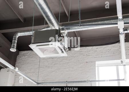 Ceiling mounted cassette type air conditioner Stock Photo