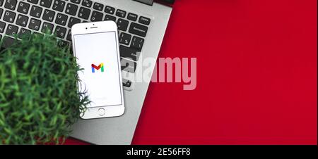 Kharkov, Ukraine - 26 January, 2021: Google gmail application logo on Apple iPhone screen, flat lay creative banner, copy space background with icon, Stock Photo