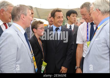 French President Nicolas Sarkozy alongside his son Louis and former Sports Minister Guy Drut pays a visit to French Olympic athletes ahead of the opening ceremony at the Olympic Village in Beijing, China on August 8, 2008. Photo by Alain Benainous/Pool/ABACAPRESS.COM Stock Photo