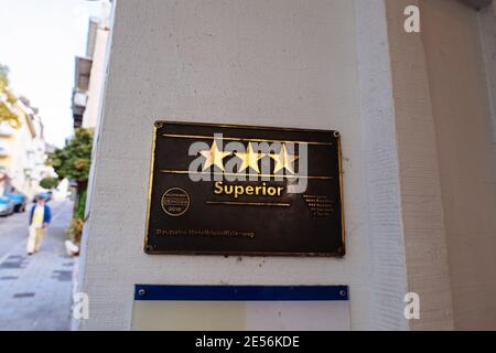 Baden-Baden, Germany - Oct 20, 2018: Three star hotel signage made from brass with Superior word attributed certified by Dehoga Stock Photo