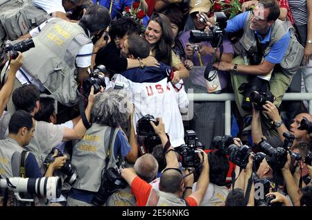 Michael Phelps of the United States greets his family, sister's Whitney and Hilary and mother Debbie in the stands as he is surrounded by photographers after receiving his gold medal in the Men's 4x100 Medley Relay at the XXIX Beijing Olympic Games Day 9 at the National Aquatic Center in Beijing, China on August 17, 2008. Photo by Willis Parker/Cameleon/ABACAPRESS.COM Stock Photo