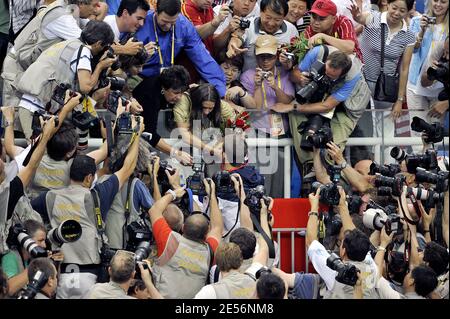 Michael Phelps of the United States greets his family, sister's Whitney and Hilary and mother Debbie in the stands as he is surrounded by photographers after receiving his gold medal in the Men's 4x100 Medley Relay at the XXIX Beijing Olympic Games Day 9 at the National Aquatic Center in Beijing, China on August 17, 2008. Photo by Willis Parker/Cameleon/ABACAPRESS.COM Stock Photo