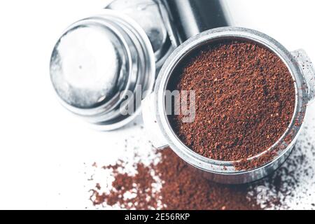 Espresso holder and replaceable coffee filters. The horn from the coffee machine on a white  Stock Photo