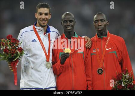 L-R) Silver medalist Mahiedine Mekhissi Benabbad of France, gold medalist Brimin Kipruto of Kenya and bronze medalists Richard Kipkemboi Mateelong of Kenya stand on the podium during the medal ceremony for the Men's 3000m Steeplechase Final of the Beijing 2008 Olympic Games Day 10 at the National Stadium in Beijing, China on August 18, 2008. Mahiedine Mekhissi Benabbad won the silver medal. Photo by Gouhier-Hahn-Nebinger/Cameleon/ABCAPRESS.COM Stock Photo