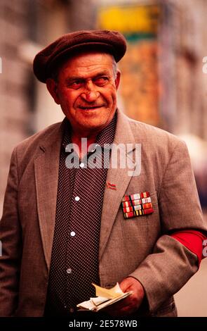 A Russian Great Patriotic War veteran proudly displays his campaign ribbons daily on the streets of Moscow. 1990 Stock Photo