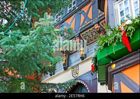 WERNIGERODE, GERMANY - NOVEMBER 23, 2012: The carved wooden sculptures and painted patterns on facade wall of Rathaus (Town Hall), on November 23 in W Stock Photo