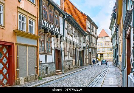 Walk historic Polle quarter and explore the medieval leaning half-timbered houses, Quedlinburg, Harz, Germany Stock Photo