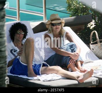 Exclusive!! Newly engaged Howard Stern and fiancee Beth Ostrosky relax at a Miami Beach hotel, 2/23/07.    [[tag mab]] Stock Photo