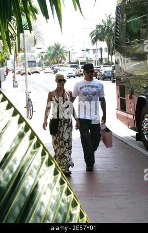 Tattooed singer Pink and Husband Carey Hart board her tour bus at her ...