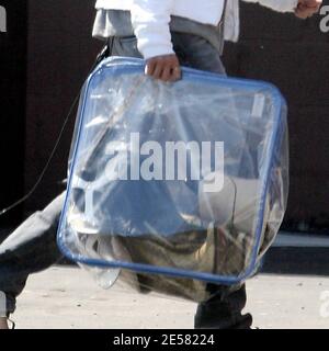 Exclusive!! Michelle Rodriguez makes her own fashion statements these days. The actress was spotted dropping off a bunch of shoes and boots at a custom design store in Hollywood, Ca. Rodriguez was also wearing a Jack Daniels bandana around her leg. 4/18/07 Stock Photo