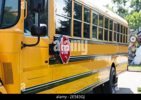Yellow school bus on the street Stock Photo