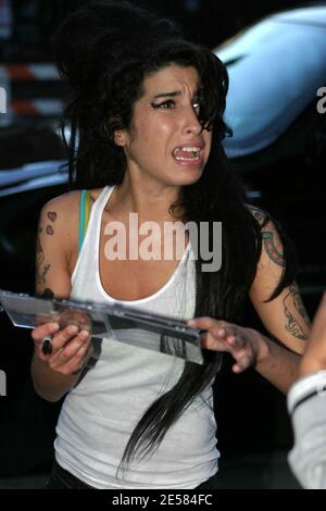 AVRIXPHOTO.COM UK Singer Amy Winehouse takes a stroll in New York with fiance Blake Fielder-Civil, stopping to sign autographs and pose for pictures with fans on the evening of the last of her sold-out shows at the Highline Ballroom. New York,NY. 5/9/07.  [[faa]] Stock Photo