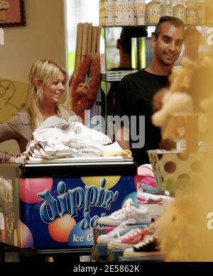 Tara Reid treated a male companion and his young daughter to a trip to Kitson Kids in Los Angeles, Calif. 5/19/07.  [[rac ral]] Stock Photo